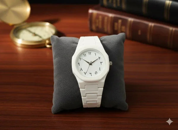 White watch on a gray cushion with a wooden background