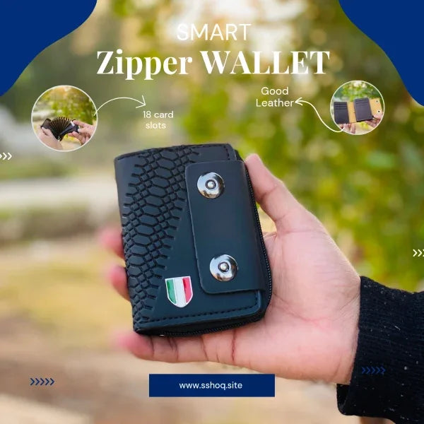 Hand holding a black smart zipper wallet with greenery in the background