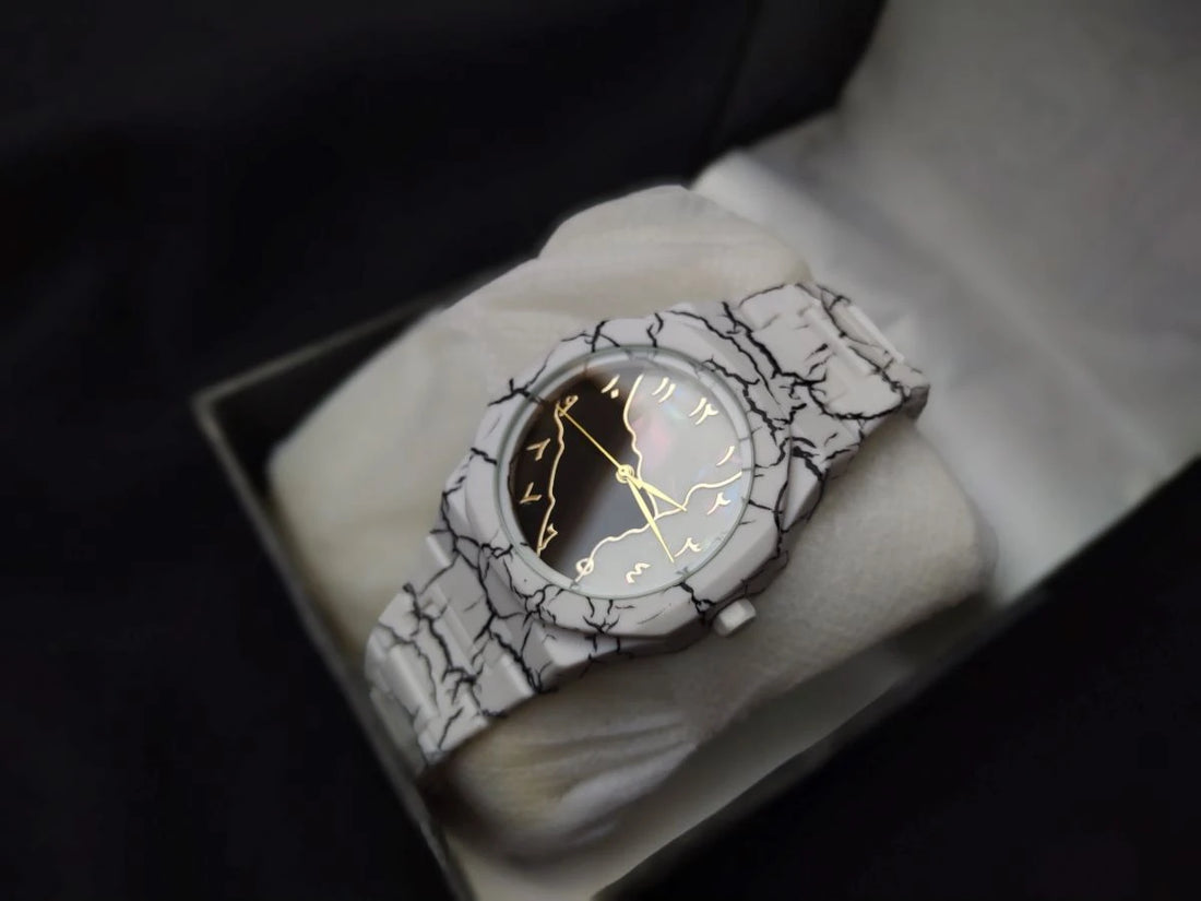 Wristwatch with a cracked design on a white surface