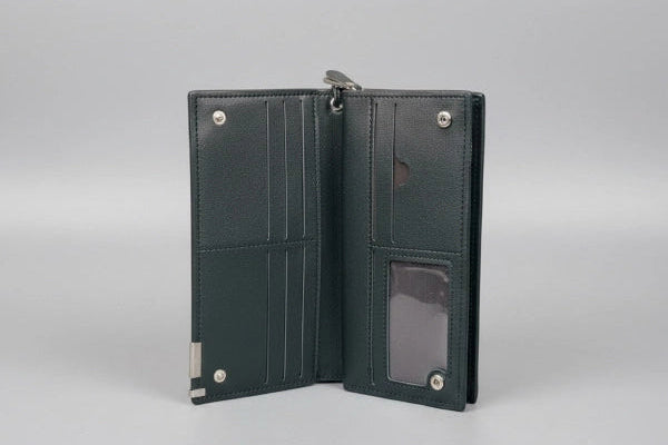 Black leather wallet open on a gray background