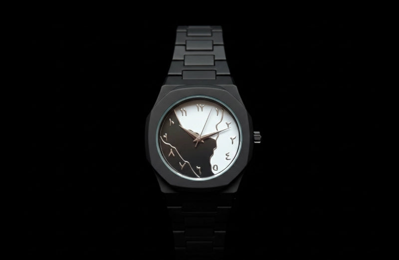 Black wristwatch with a unique face design on a black background