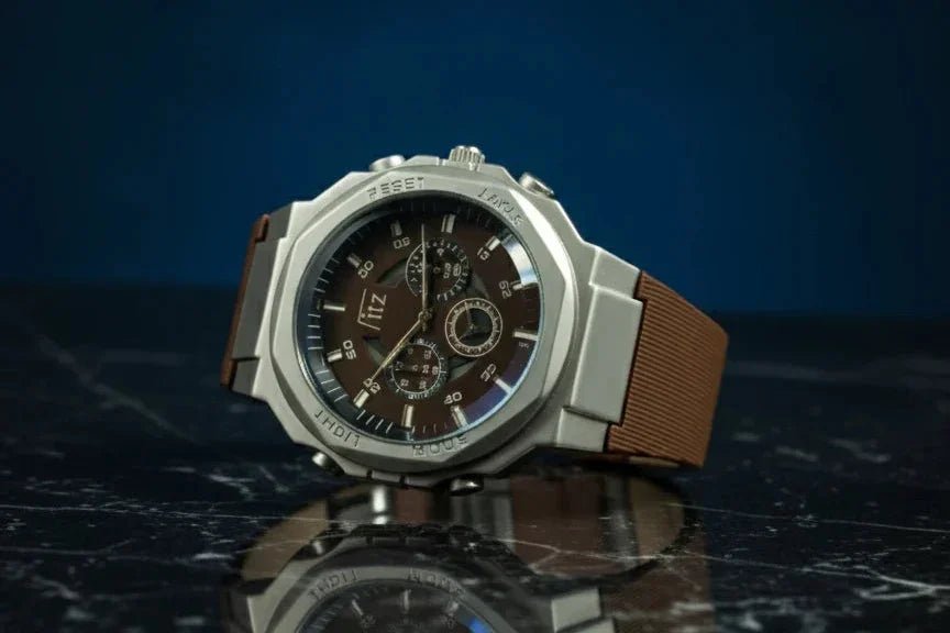 Luxury watch with brown strap on a reflective surface with a dark blue background