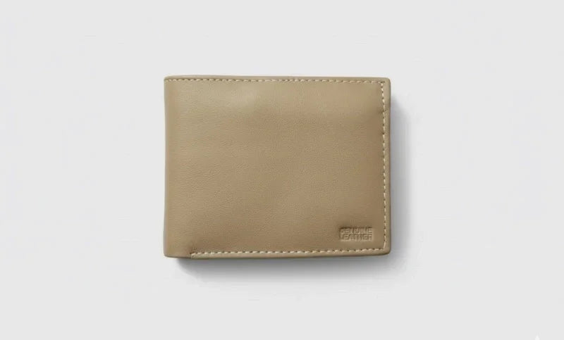 Beige leather wallet on a light gray background