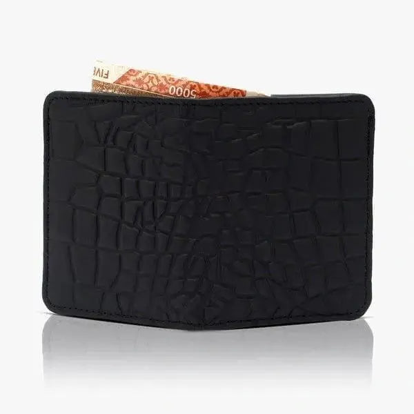 Black textured wallet with a card partially pulled out on a white background