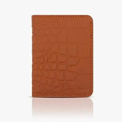 Brown leather cardholder with crocodile texture on a white background