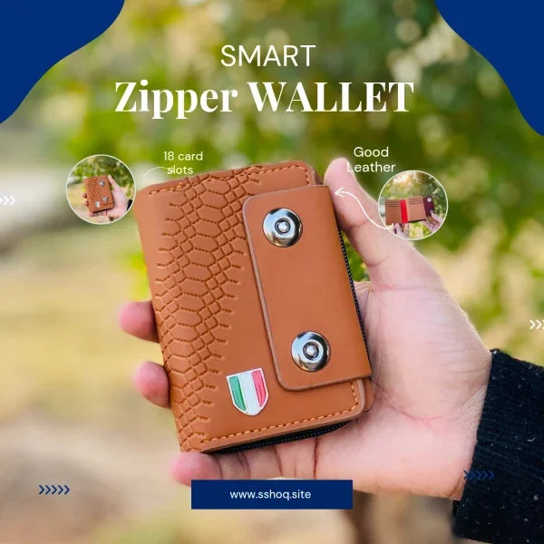 Brown smart zipper wallet held in a hand with greenery in the background