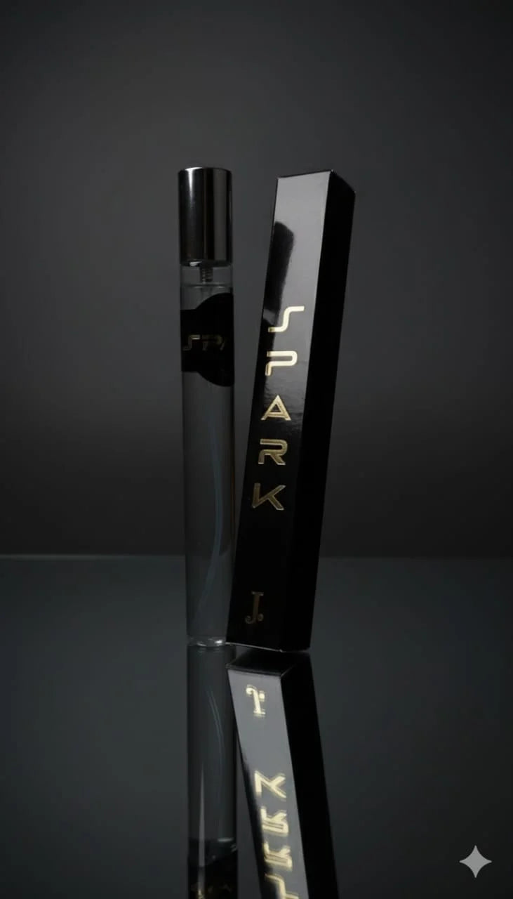 Black vape device with 'Spark' branding on a reflective surface against a dark background