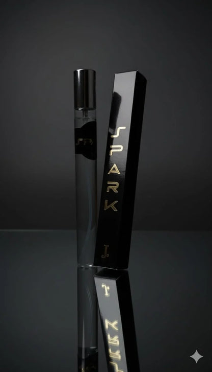 Black vape device with 'Spark' branding on a reflective surface against a dark background