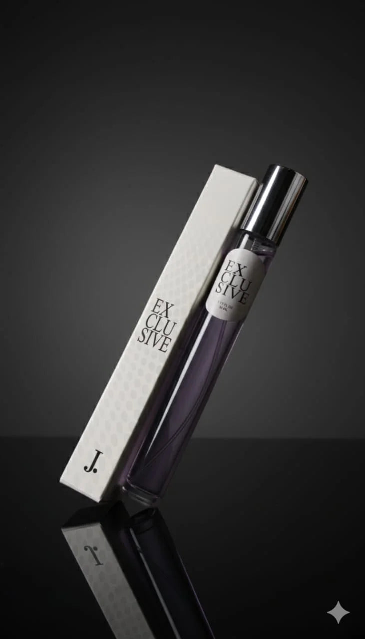Perfume bottle labeled 'Exclusive' with packaging on a reflective surface